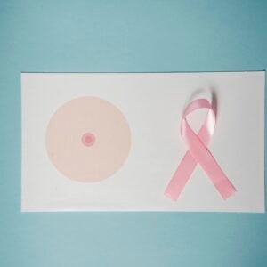 Pink Ribbon On Top Of A Paper